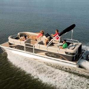 A family cruises the Currituck Sound on a pontoon boat