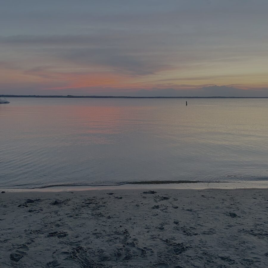 Sunset painting the sky orange over the Currituck Sound